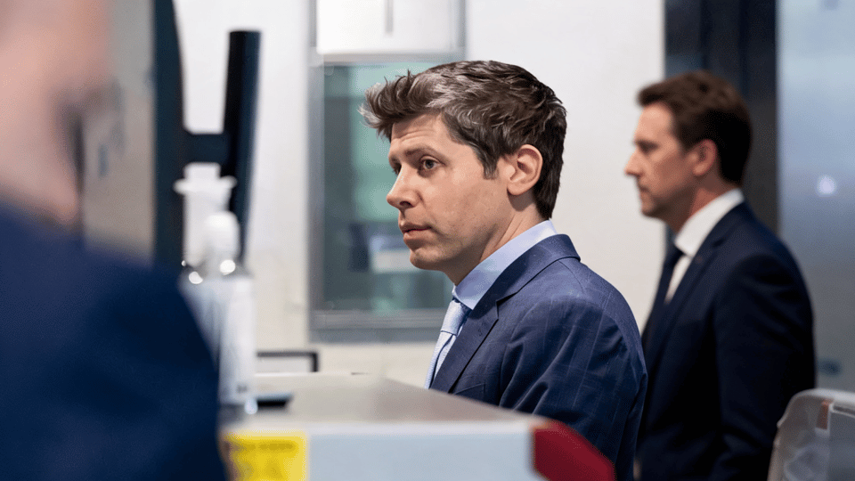 OpenAI CEO Sam Altman looking serious in a dark blue suit