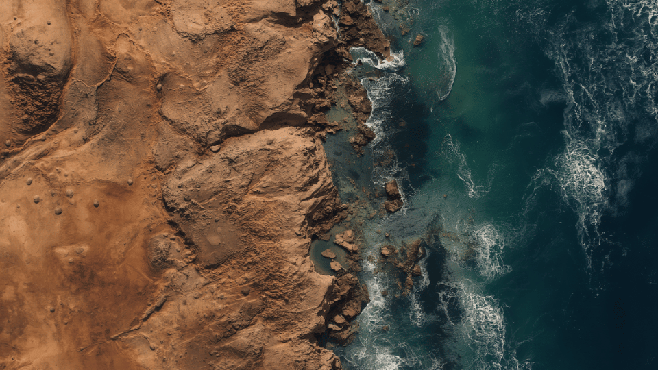 n aerial satellite view of a dry desert coastline and ocean terrain