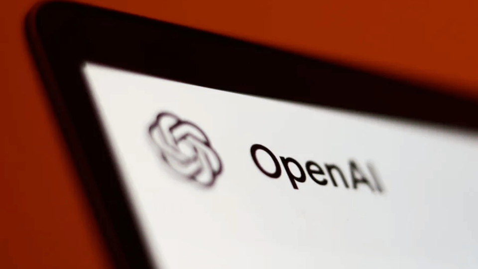 A close-up view of a tablet screen showing the OpenAI ChatGPT interface on a kitchen counter with a blurred breakfast setup in the background.