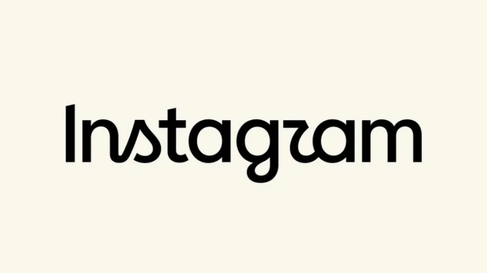 The black Instagram wordmark logo displayed clearly on an off-white screen background.