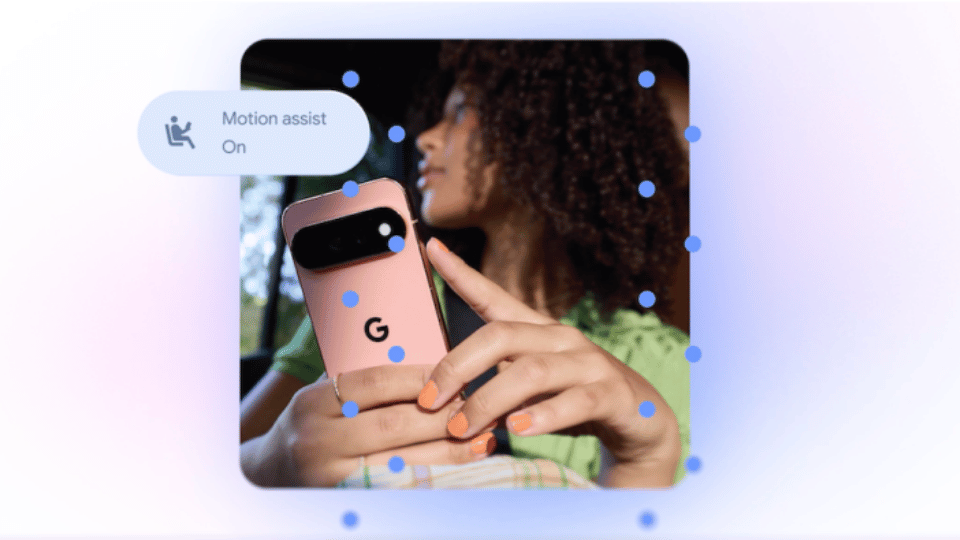 Hands holding a pink Google Pixel phone displaying an Android setting menu on screen.